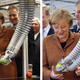 Image for article titled Why Is Angela Merkel Always Palling Around With Robots?